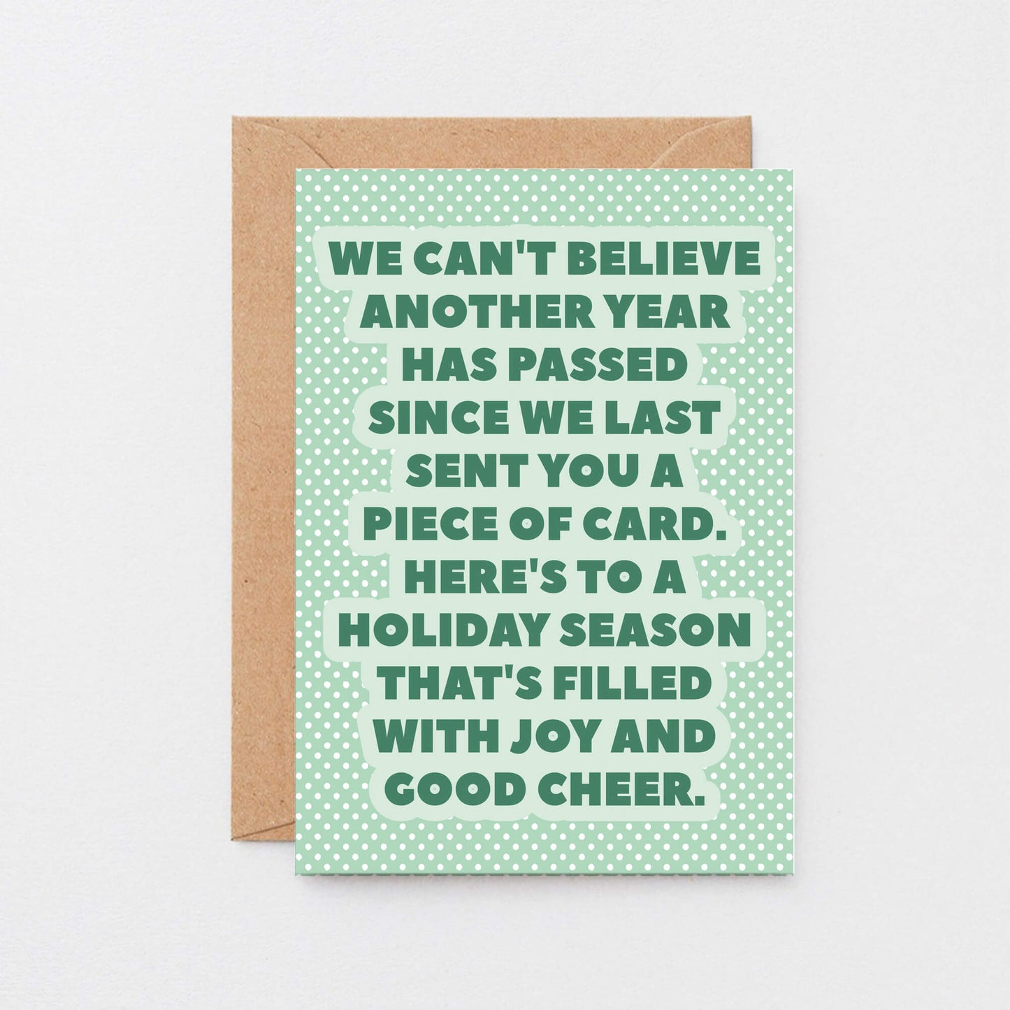 Christmas Card by SixElevenCreations. Reads We can't believe another year has passed since we last sent you a piece of card. Here's to a holiday season that's filled with joy and good cheer. Product Code SEC0077A6