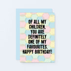 A birthday greeting card with a pastel polka dot pattern and bold black text reading 'OF ALL MY CHILDREN, YOU ARE DEFINITELY ONE OF MY FAVOURITES. HAPPY BIRTHDAY!' shown with a light blue envelope on a pale blue background. Designed by SixElevenCreations. Product Code SE3704A6