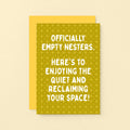 Empty Nester Card by SixElevenCreations. A yellow greeting card with a geometric pattern and white text reading 'OFFICIALLY EMPTY NESTERS. HERE'S TO ENJOYING THE QUIET AND RECLAIMING YOUR SPACE!' shown with a solid yellow envelope on a light yellow background. Product Code SE1403A6