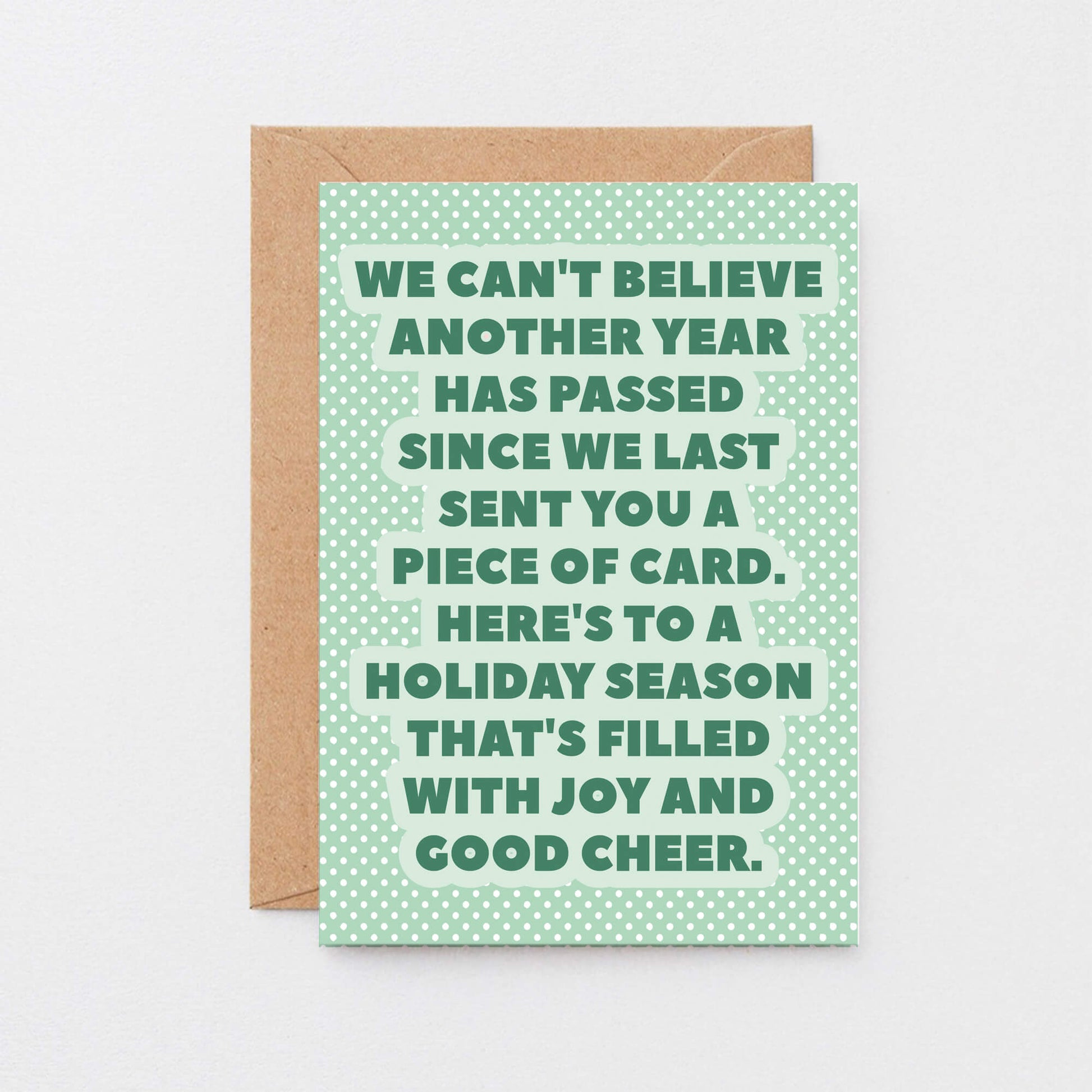 Christmas Card by SixElevenCreations. Reads We can't believe another year has passed since we last sent you a piece of card. Here's to a holiday season that's filled with joy and good cheer. Product Code SEC0077A6
