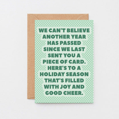 Christmas Card by SixElevenCreations. Reads We can't believe another year has passed since we last sent you a piece of card. Here's to a holiday season that's filled with joy and good cheer. Product Code SEC0077A6