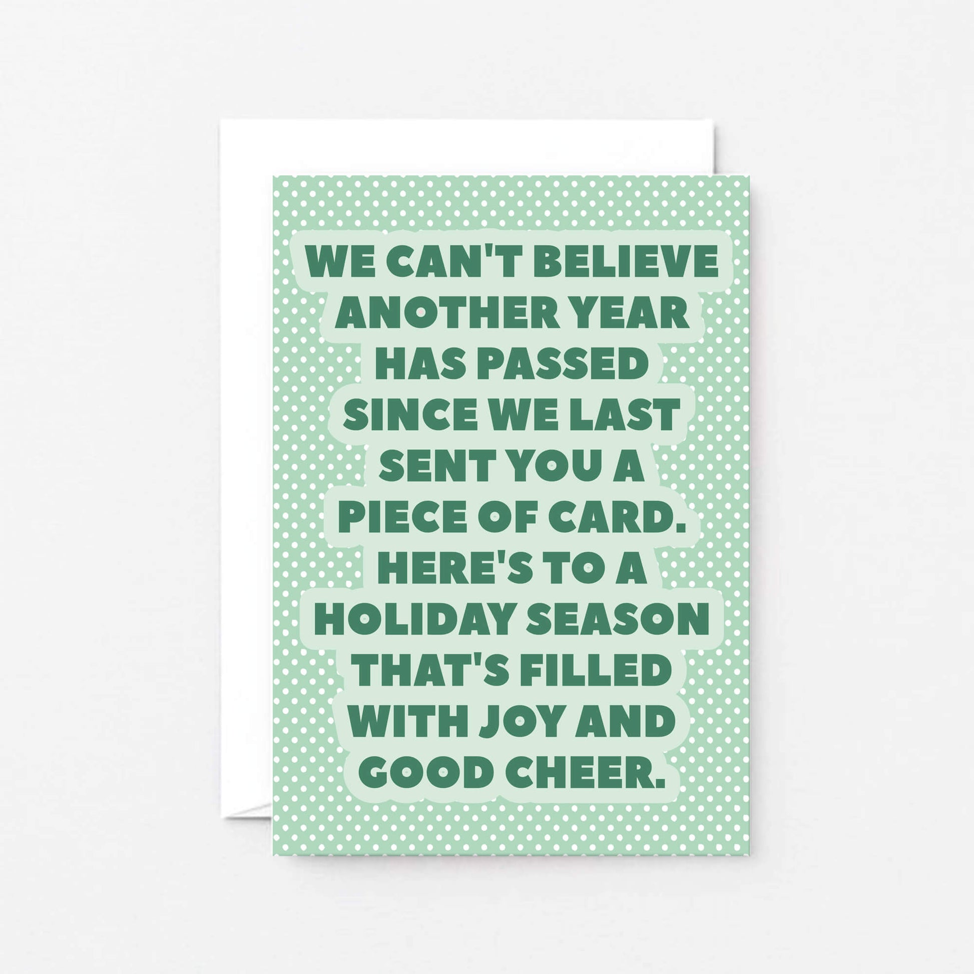 Christmas Card by SixElevenCreations. Reads We can't believe another year has passed since we last sent you a piece of card. Here's to a holiday season that's filled with joy and good cheer. Product Code SEC0077A6