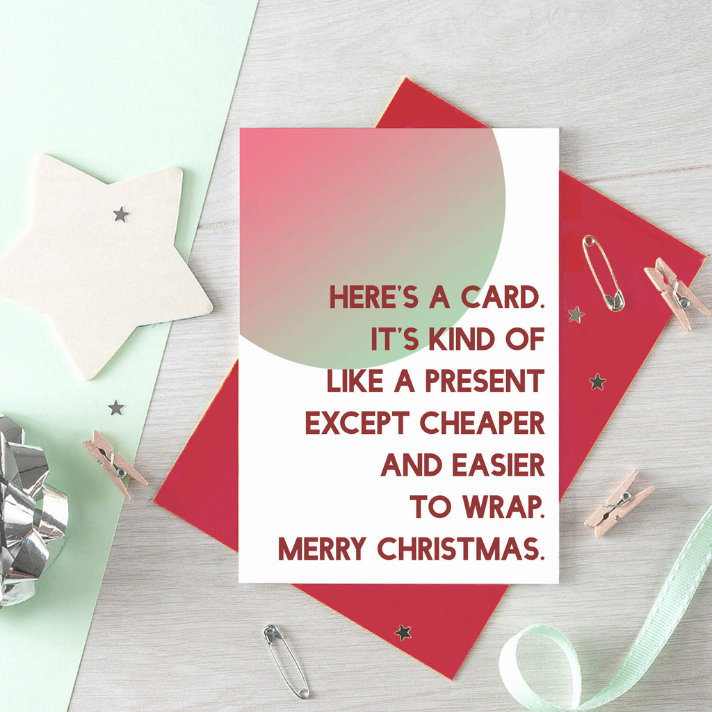 Christmas Card by SixElevenCreations. Reads Here's a card. It's kind of like a present except cheaper and easier to wrap. Merry Christmas. Product Code SEC0041A6