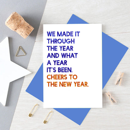 New Year Card by SixElevenCreations. Reads We made it through the year and what a year it's been. Cheers to the new year. Product Code SEC0052A6